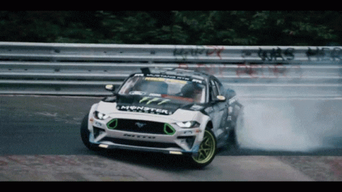 A Ford Mustang Drifting On A Race Track GIF