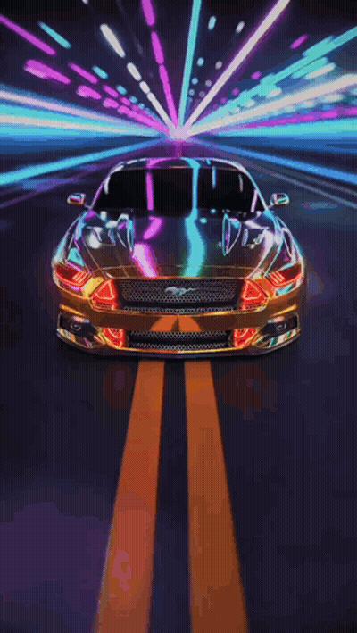 A Ford Mustang Is Driving Down A Road At Night GIF