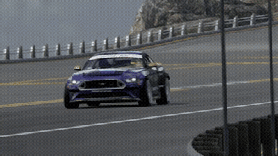 A Ford Mustang Is Driving Down A Road In A Video Game GIF