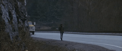 A Ford Truck Is Driving Down The Road Next To A Van GIF