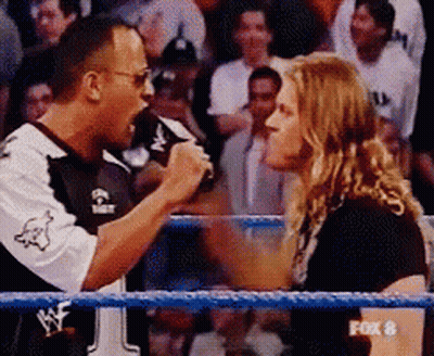 A Fox 8 Broadcast Of A Wrestling Match Between The Rock And A Woman GIF