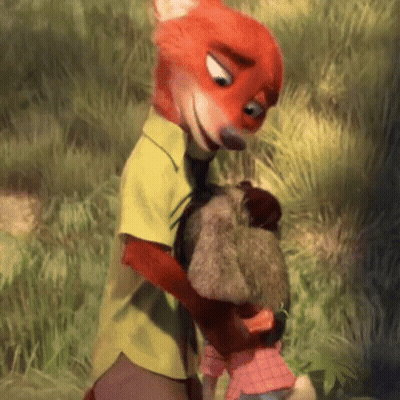 A Fox Is Holding A Stuffed Animal In His Arms While Standing Next To A Rabbit . GIF
