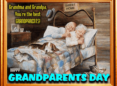 A Framed Picture Of An Elderly Couple Laying In Bed With A Dog And The Words Grandparents Day GIF