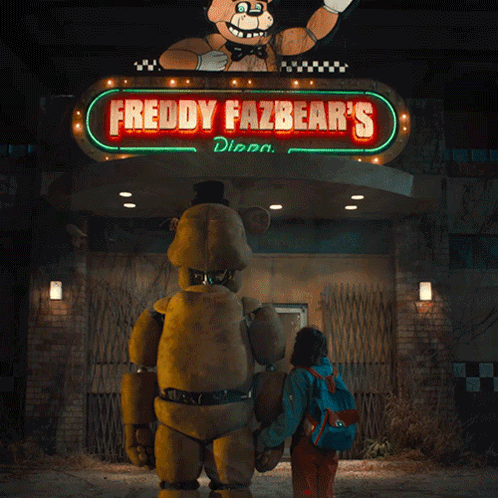 A Freddy Fazbear 'S Sign With A Teddy Bear On Top GIF