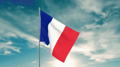 A French Flag Is Waving In The Wind Against A Cloudy Blue Sky GIF