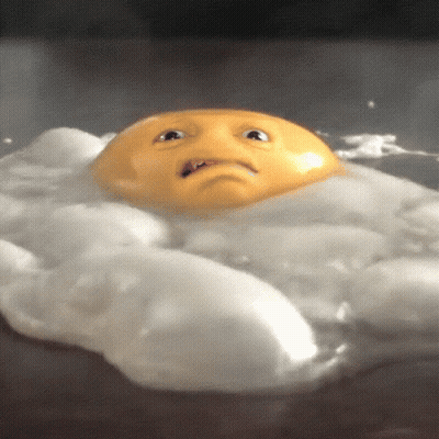 A Fried Egg With A Face On It Is Floating In The Water GIF