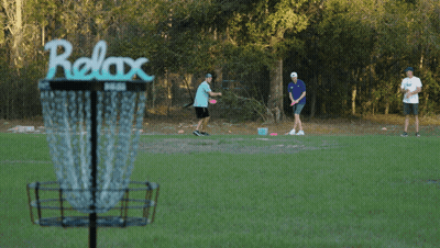 A Frisbee Is Being Thrown Into A Basket That Says Prize On It GIF