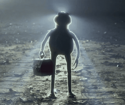 A Frog Is Holding A Briefcase And Standing In The Dark GIF