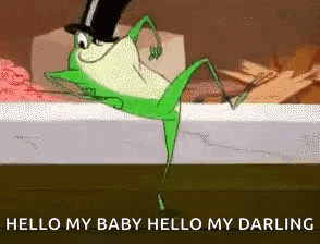A Frog Wearing A Top Hat Is Dancing On A Bed . GIF