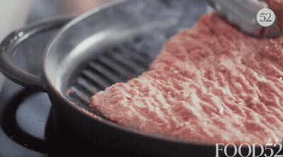 A Frying Pan Filled With Meat And The Number 52 On The Bottom GIF