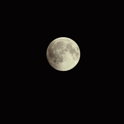 A Full Moon Is Visible In The Dark Night Sky GIF