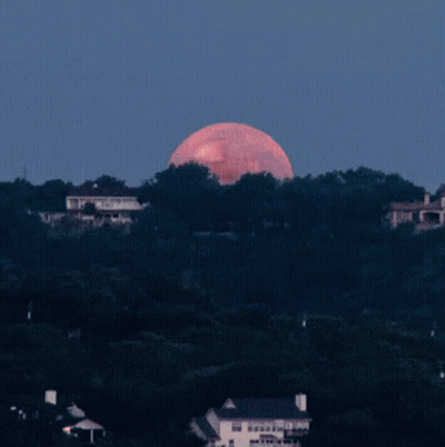 A Full Moon With A Cartoon Face On It GIF