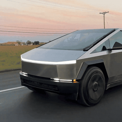 A Futuristic Car Is Driving Down A Road GIF