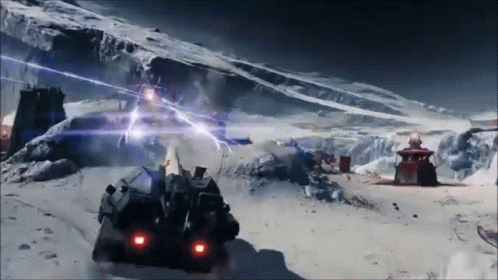 A Futuristic Vehicle Is Driving Through A Snowy Mountain GIF