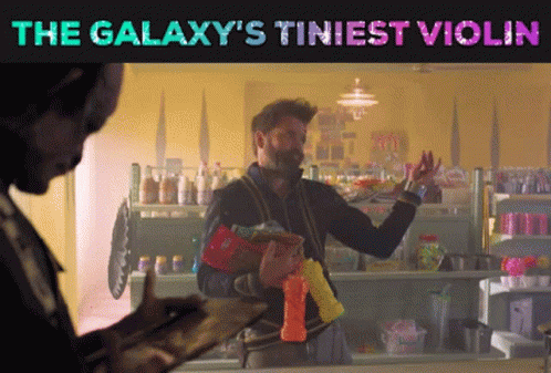 A Galaxy 'S Tiniest Violin Poster With A Man GIF