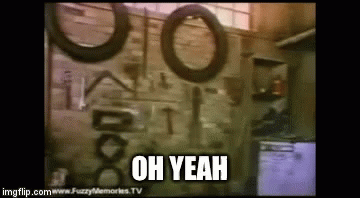 A Garage With Tires Hanging On The Wall And The Words Oh Yeah Written On The Bottom GIF