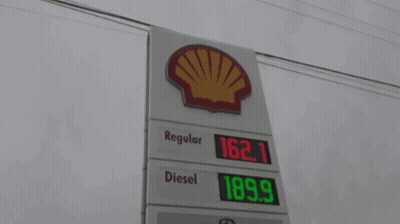 a gas station with a sign that says regular diesel and bmo on it