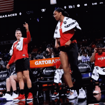 A Gatorade Banner Is Being Held Up By A Basketball Player GIF