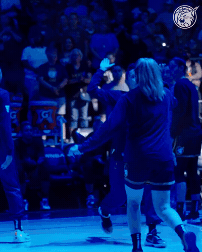 A Gatorade Bucket Sits Behind A Basketball Player On The Court GIF