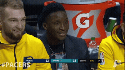 A Gatorade Cooler Is In The Background Of A Basketball Game Between The Pacers And Hornets GIF