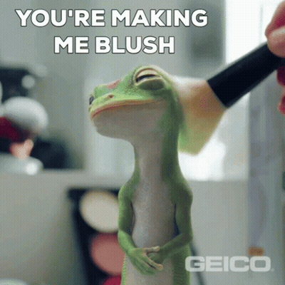 A Geico Lizard Is Being Brushed With A Brush GIF