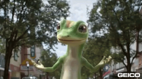 A Geico Lizard Is Standing On A Street With Its Arms Outstretched . GIF