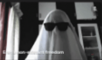 A Ghost Is Wearing Sunglasses And A White Sheet Over His Head . GIF