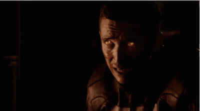 A Ghost Rider With Flames Coming Out Of His Head Is Looking At The Camera . GIF