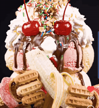 A Giant Ice Cream Sundae With A Banana And Cherry On Top GIF