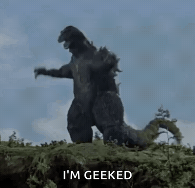 A Giant Monster Is Standing On Top Of A Hill . GIF