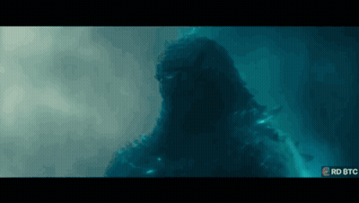 A Giant Monster Is Swimming In The Water In A Movie Scene From The Movie Godzilla King Of The Monsters . GIF