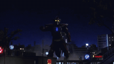 A Giant Robot Is Standing In Front Of A Mcdonald 'S Restaurant GIF