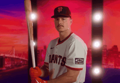 A Giants Baseball Player Is Holding A Bat GIF