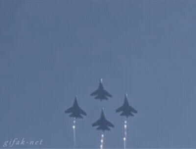 A Gif From Gifak.net Shows A Plane Flying Through The Air GIF