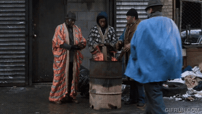 A Gif From Gifrun.com Shows A Man In A Blue Coat Talking To Two Other Men GIF