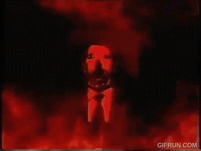 A Gif From Gifrun.com Shows A Painting Of A Man 'S Face Surrounded By Fire GIF