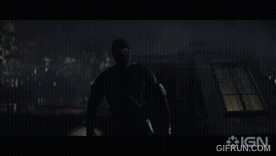 A Gif From Ign Shows A Man In A Mask In The Dark GIF