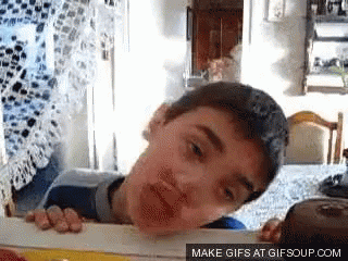 A Gif Of A Boy Peeking Over A Table With The Text Make Gifs At Gifsoup.com GIF