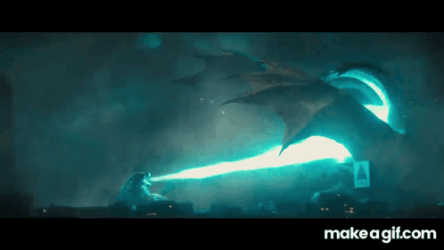 A Gif Of A Dragon Shooting A Beam Of Light At A Monster GIF