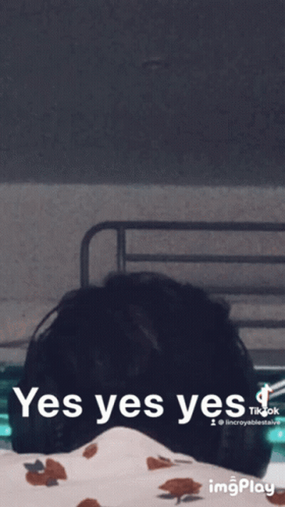 A Gif Of A Person Laying On A Bed With The Words Yes Yes Yes GIF