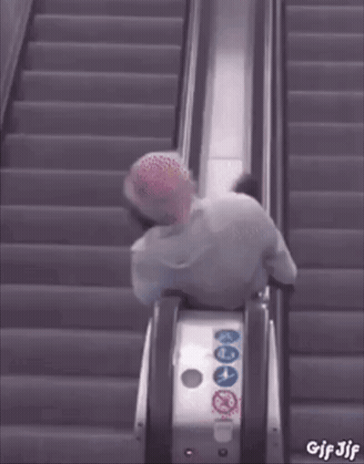 A Gif Of A Person Riding An Escalator With The Words Gif Jjf On The Bottom GIF