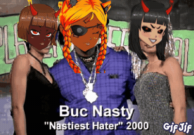 A Gif Of Buc Nasty Standing With Two Girls GIF