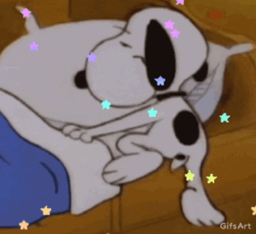 A Gif Of Snoopy Sleeping On A Bed With Stars Around Him GIF