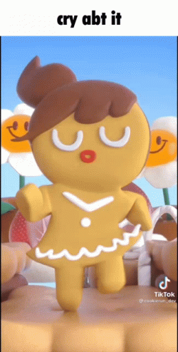 A Gingerbread Girl With A Bun On Her Head Is Dancing GIF