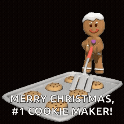 A Gingerbread Man Is Holding A Spatula Over A Tray Of Cookies And Wishing Merry Christmas . GIF