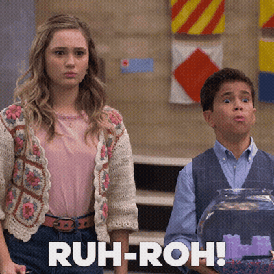 A Girl And A Boy Are Standing Next To Each Other With The Words Ruh-Roh In The Corner GIF