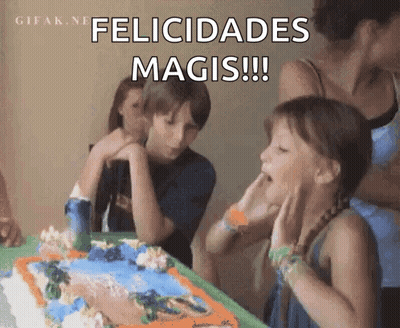 A Girl Blowing Out A Candle On A Birthday Cake GIF