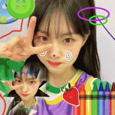 A Girl Giving A Peace Sign With A Strawberry On Her Face GIF