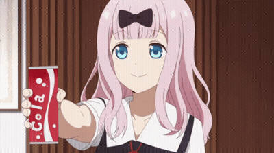 A Girl Holding A Can Of Cola In Her Hand GIF