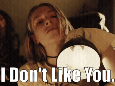 A Girl Holding A Light With The Words I Don 'T Like You GIF